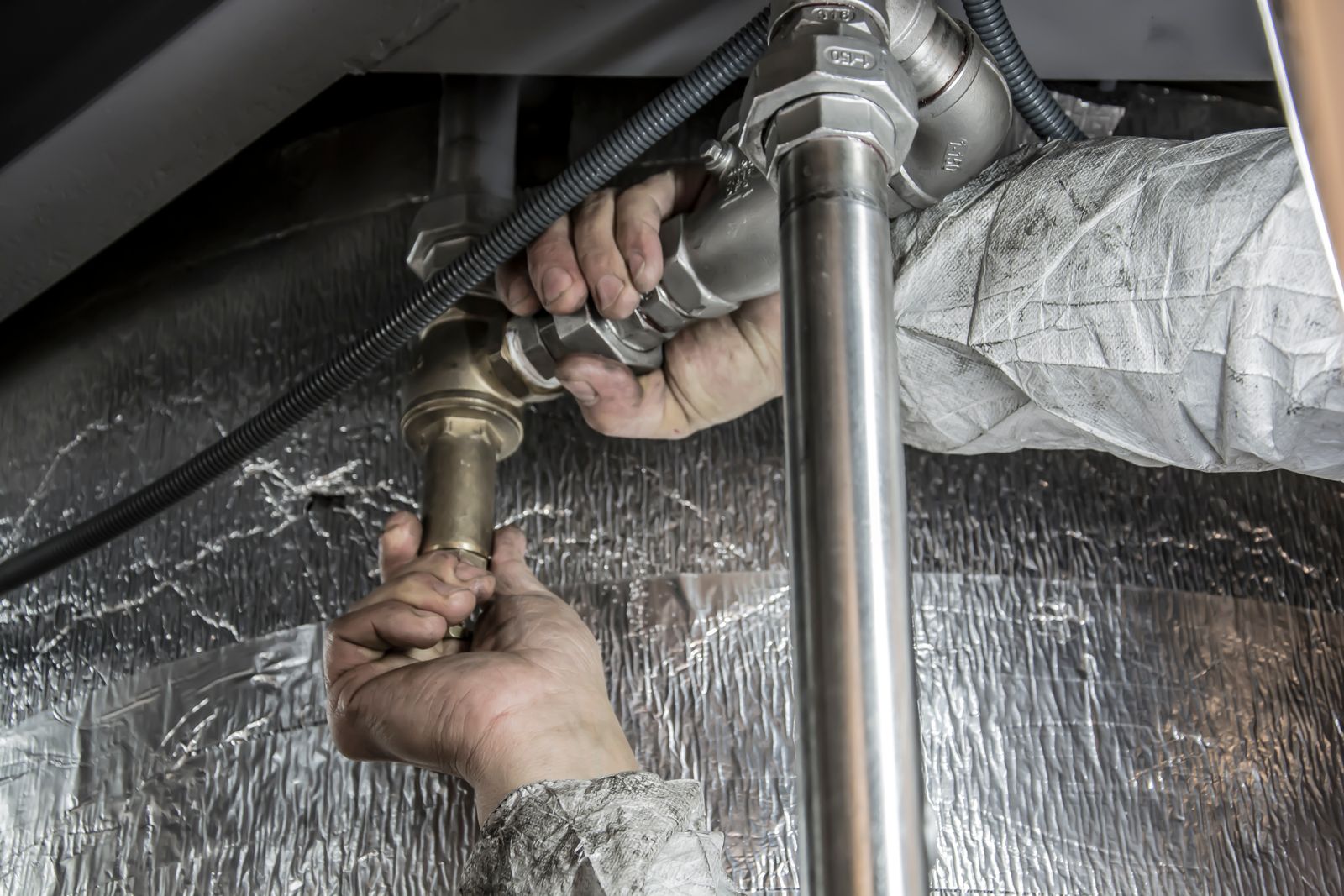 Pipe work in an insulated equipment space — west-valley heater and scale jobs.