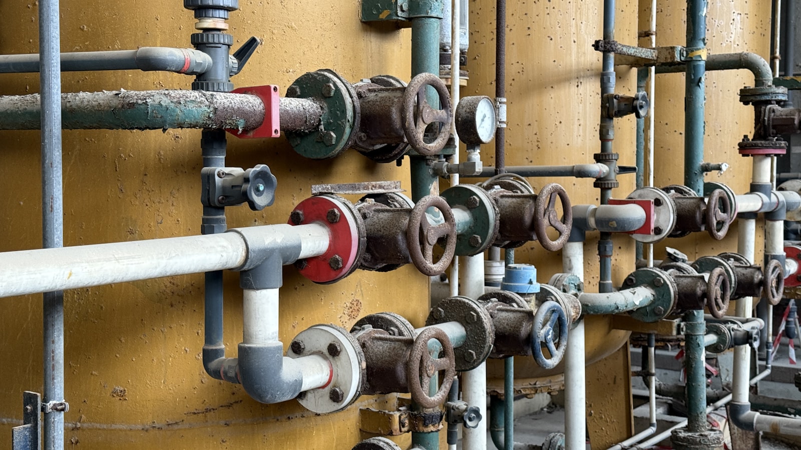 Commercial valves and tanks in a mechanical room downtown.